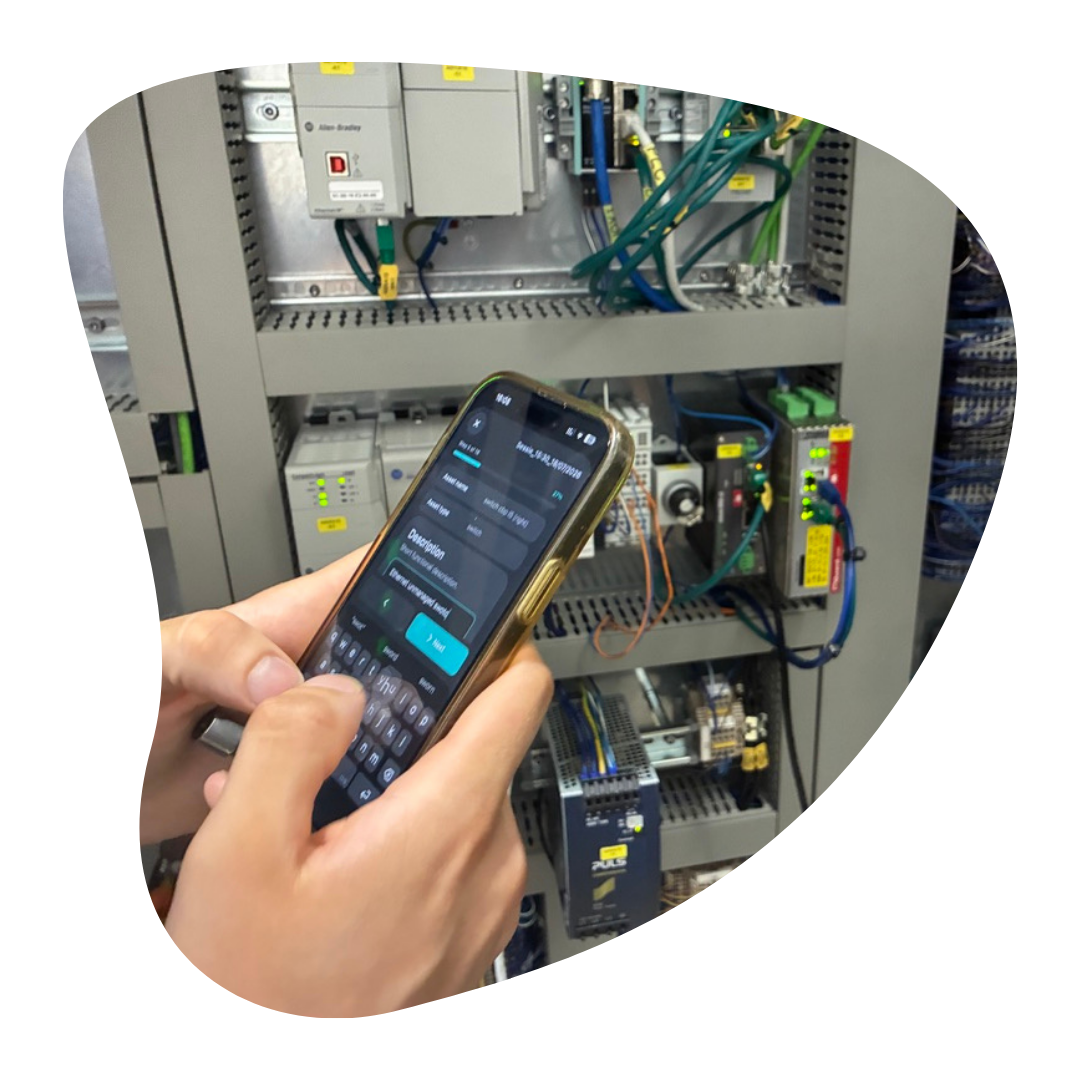 OT Catcher being used on an iPhone to capture asset data at an industrial control cabinet.